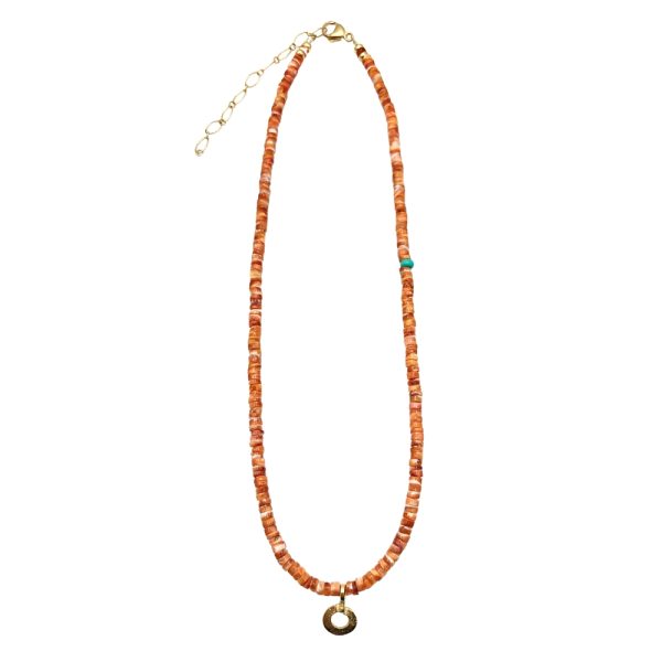 Gold and coral beaded necklace with pendant.