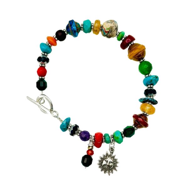 Colorful gemstone bracelet with sun charm.