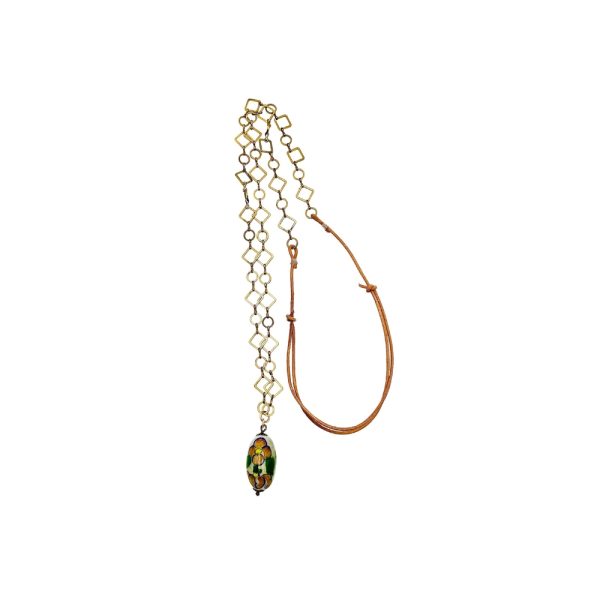 Gold chain necklace with floral pendant.