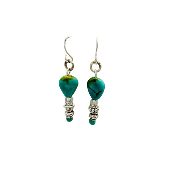 Turquoise and silver dangle earrings.